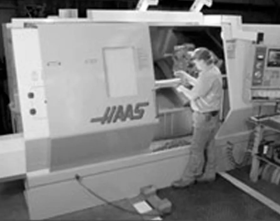 OWI employee working with CNC machine in Odessa, TX