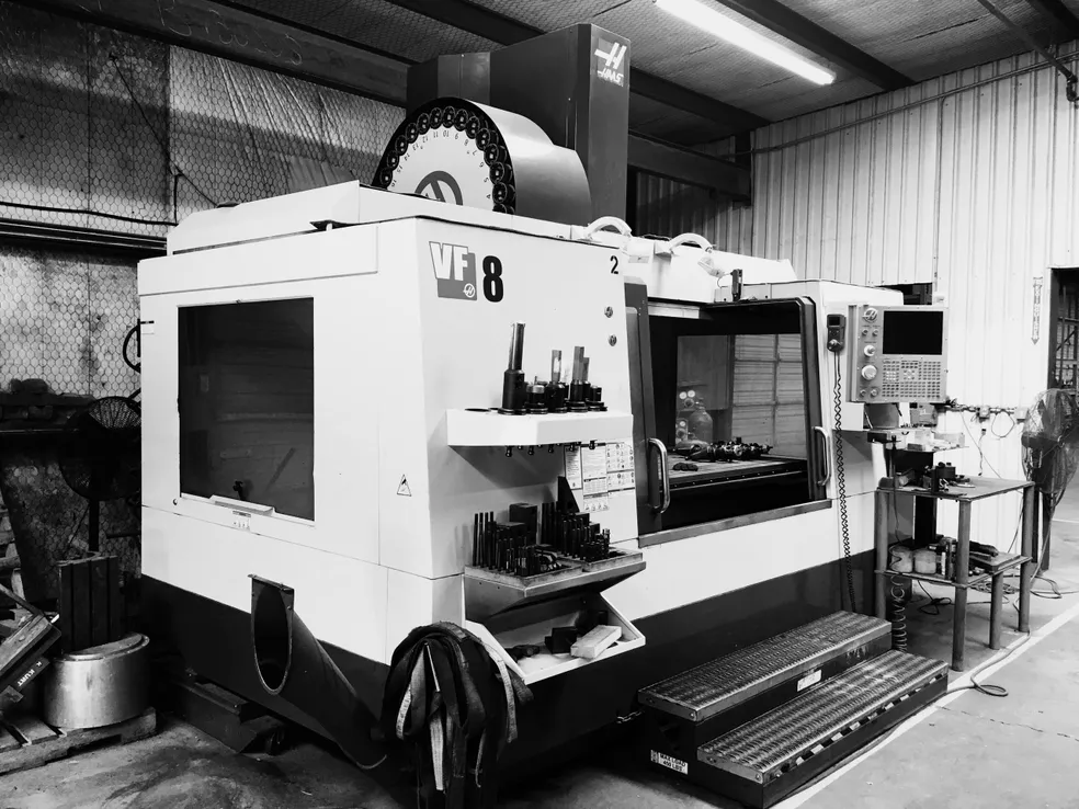 black and white image of CNC machine shop