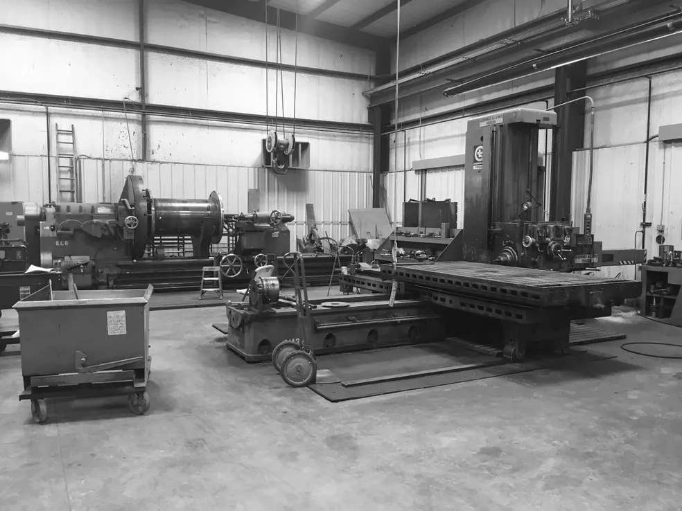 wide view of machine shop focusing on manual mill